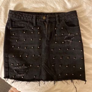 Black studded mini skirt